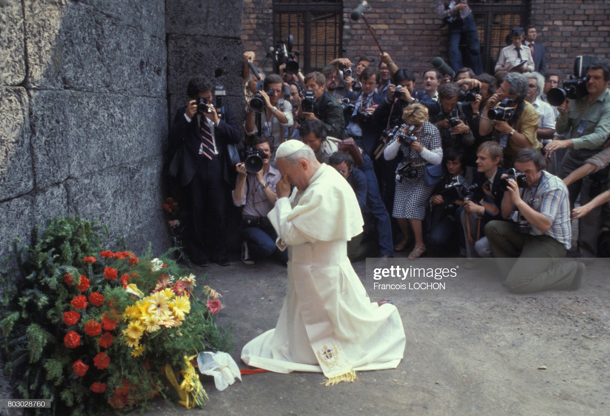 Anti-pope John Paul II kneels before the idol of Holocaustianity at Auschwitz June 1979.